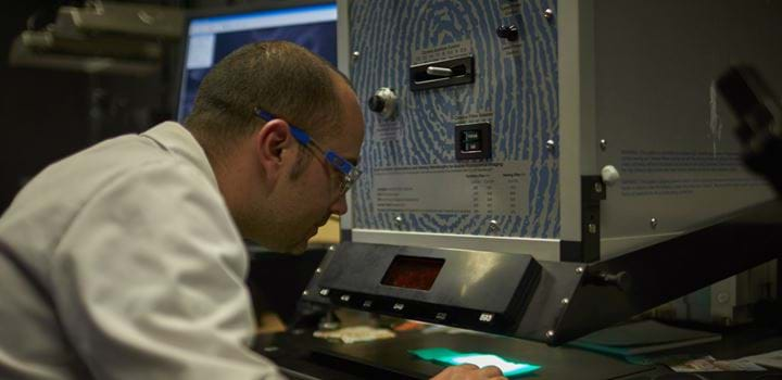 Male using laboratory equipment