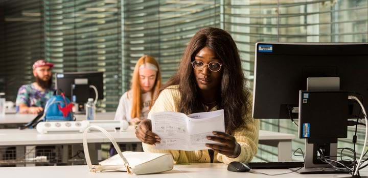 Students studying in the Acadian Shores library.